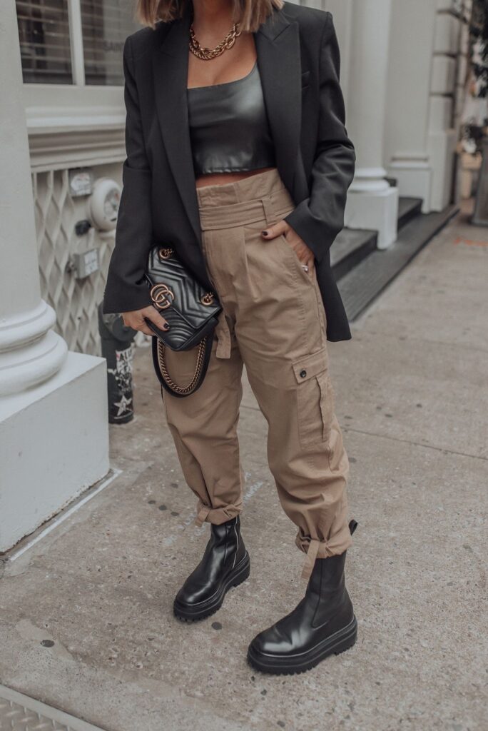 A lady wearing combat pants and boots