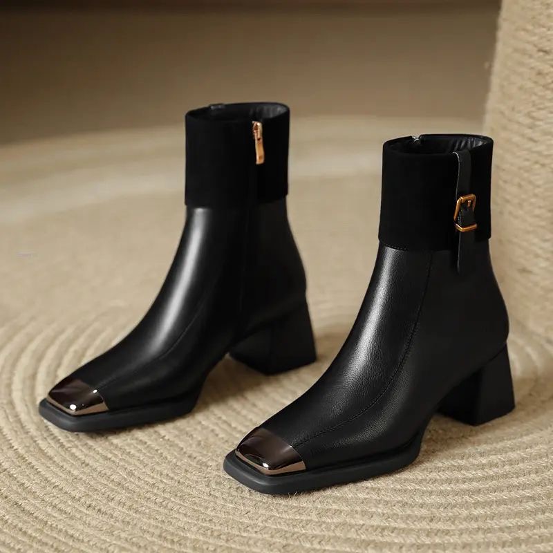 A black leather boot with gold metallic tips and a side zipper to improve styling tricks to elevate basic outfits