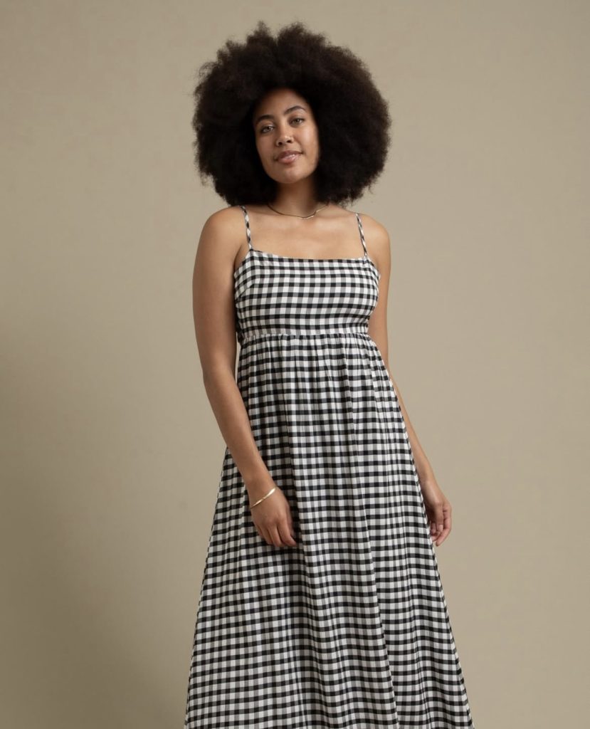 A beautiful ladyy wearing a lovely black and white check maxi dress