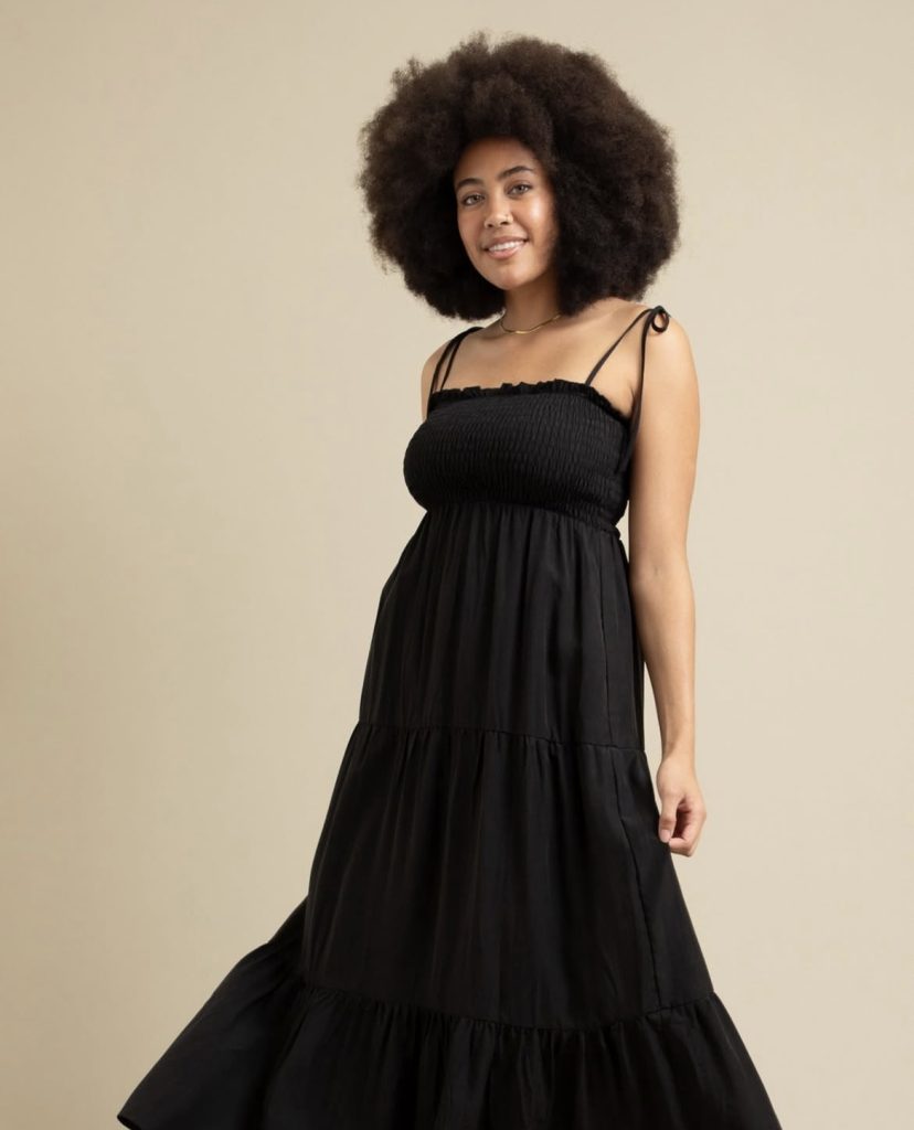A beautiful ladyy wearing a lovely black maxi dress