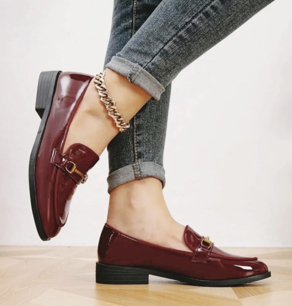 A maroon colored pair of loafers