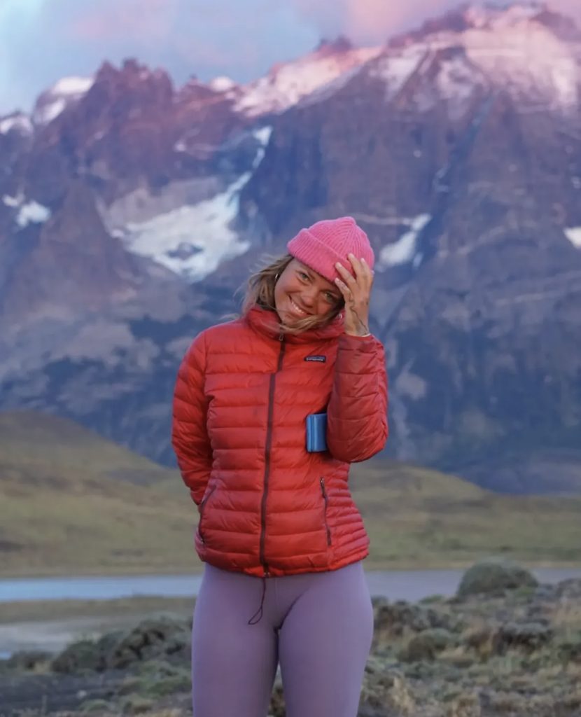 A beautiful lady wearing a sustainable jacket from a brand called Patagonia