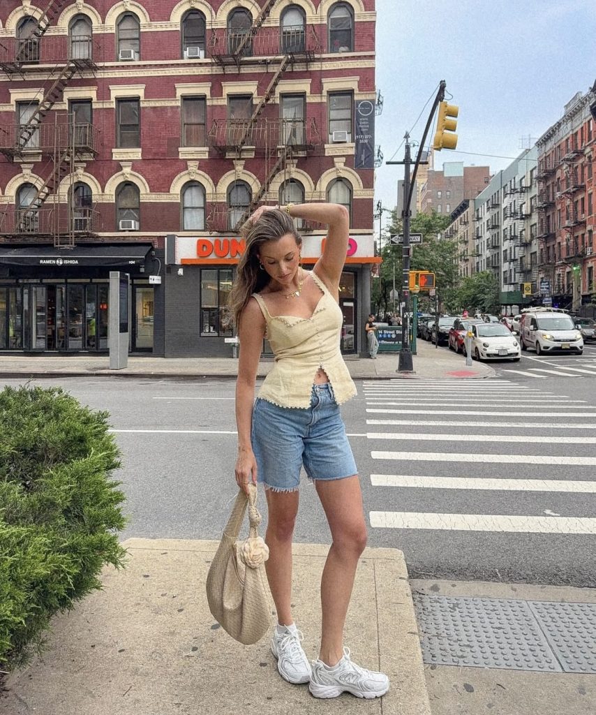 A beautiful lady wearing a sustainable top from a brand called Reformation