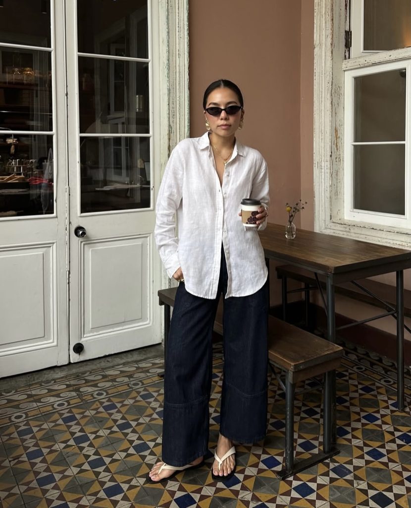 A beautiful white lady wearing outfits from a fashion brand called everlane