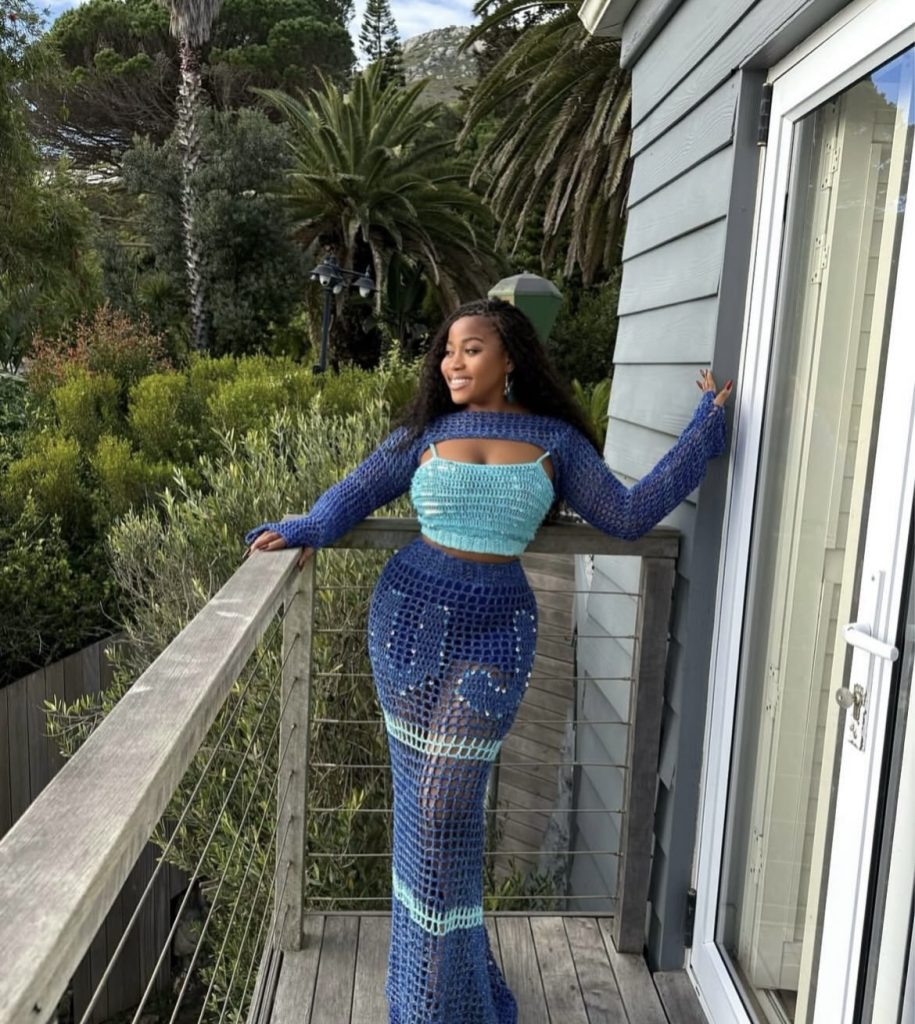 A beautiful lady wearing very colorful and pretty crochet outfit
