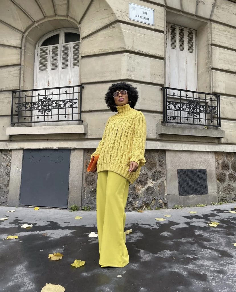 A beautiful lady wearing a yellow monochromatic outfit 