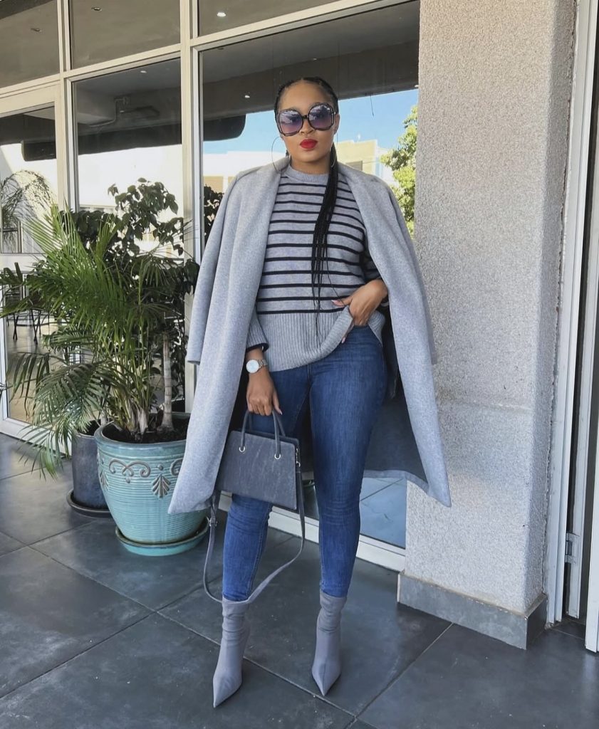 A beautiful black lady styling her matching shoes and bag