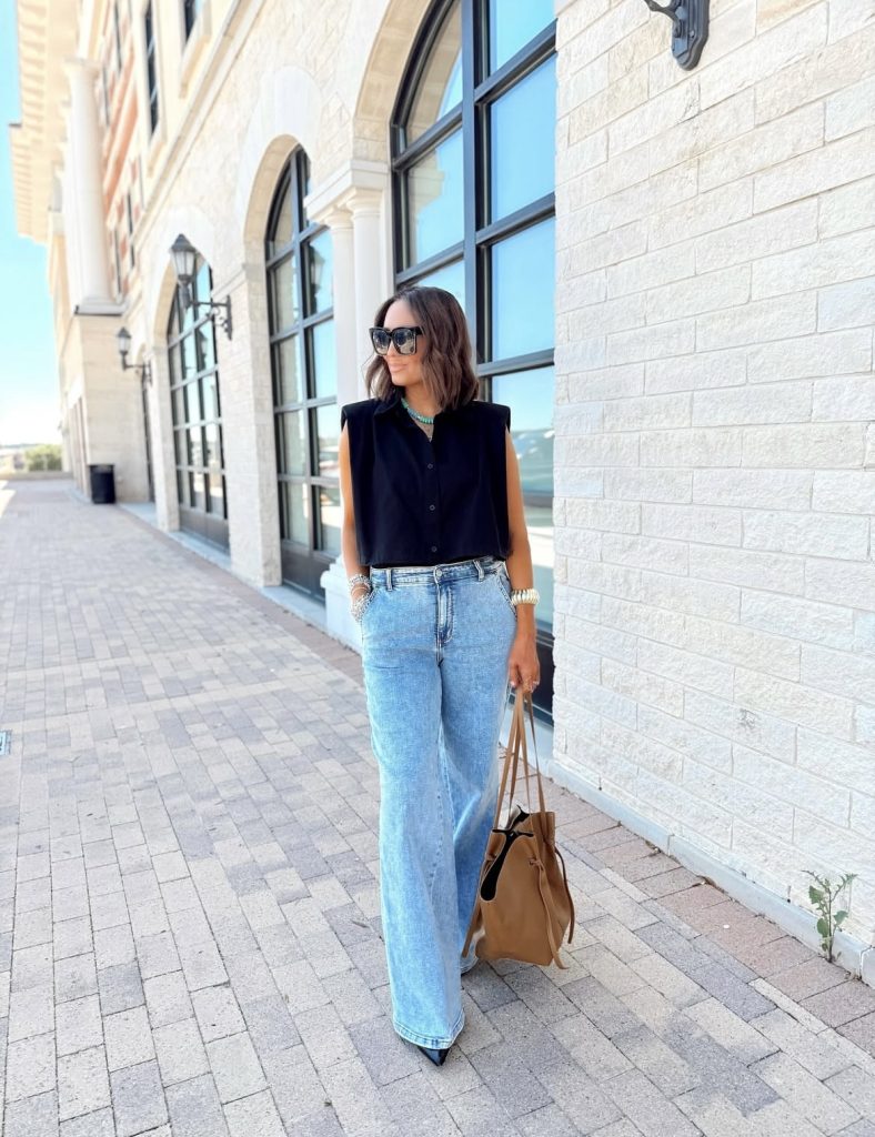 A beautiful lady wearing a power shoulder outfit