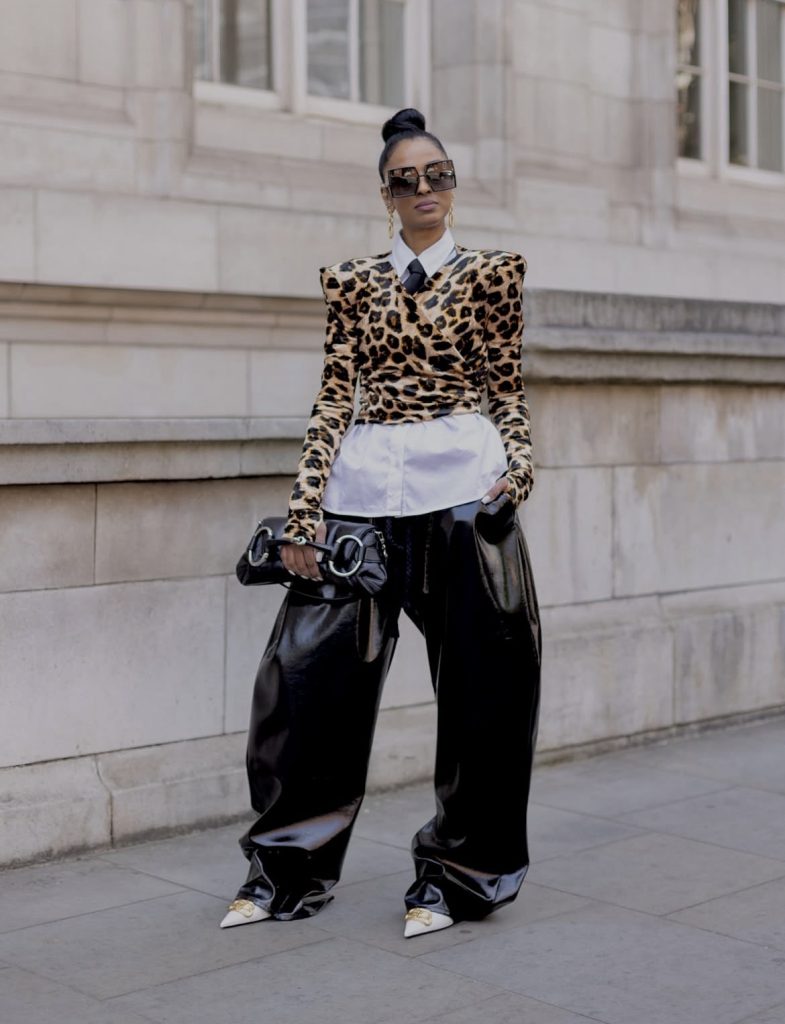 A beautiful lady wearing a shoulder padded outfit