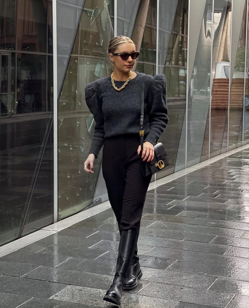 A beautiful lady wearing a power shoulder outfit