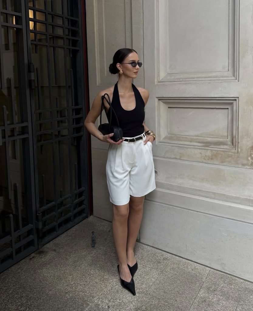 A lady wearing a white baggy short